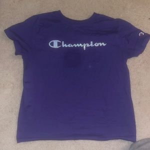 Purple Champion shirt. No stain, it is a camera error.